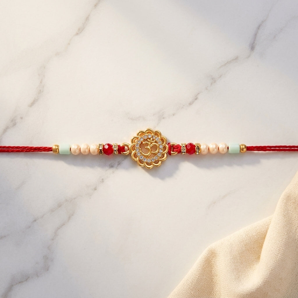 Golden Om Lotus CZ Rakhi with Crystal Beads