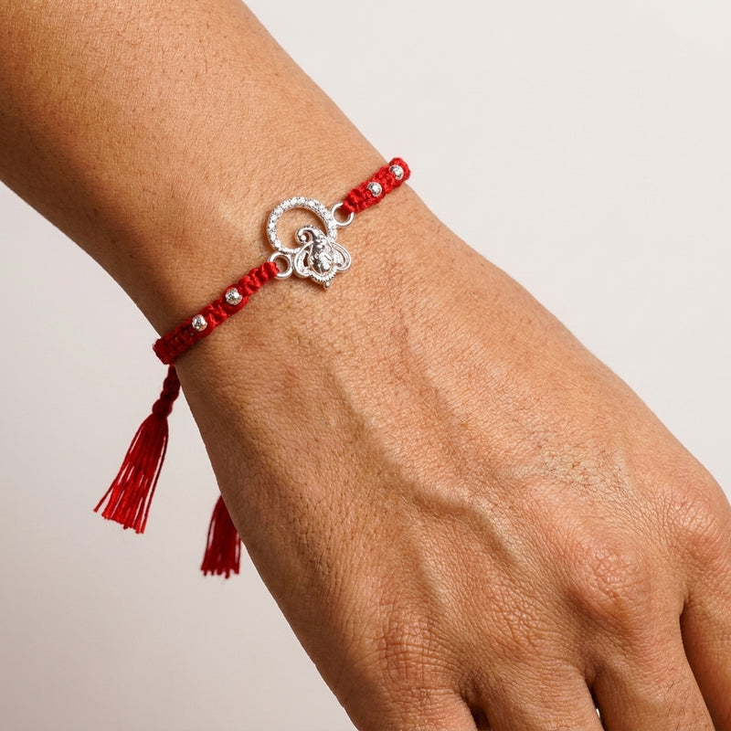 Silver Ganesha Rakhi with Red Tassel