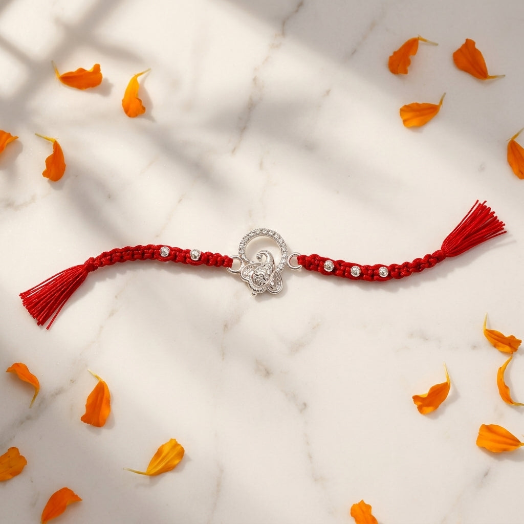 Silver Ganesha Rakhi with Red Tassel